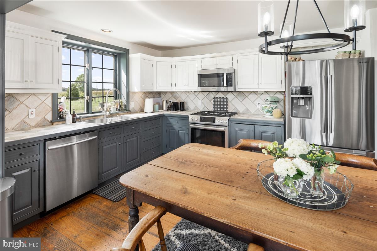 2753 Rushland Road Jamison, PA 18929 - Photo 9 of 60 a kitchen with a table chairs sink and cabinets