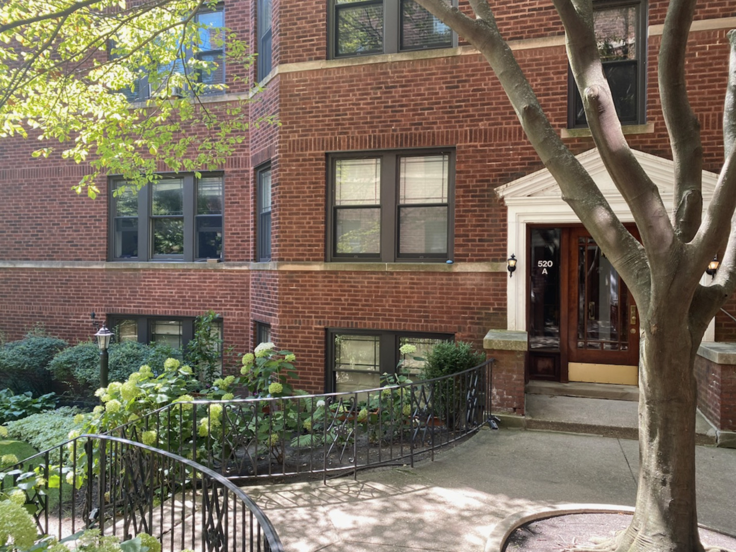front view of a house with a garden