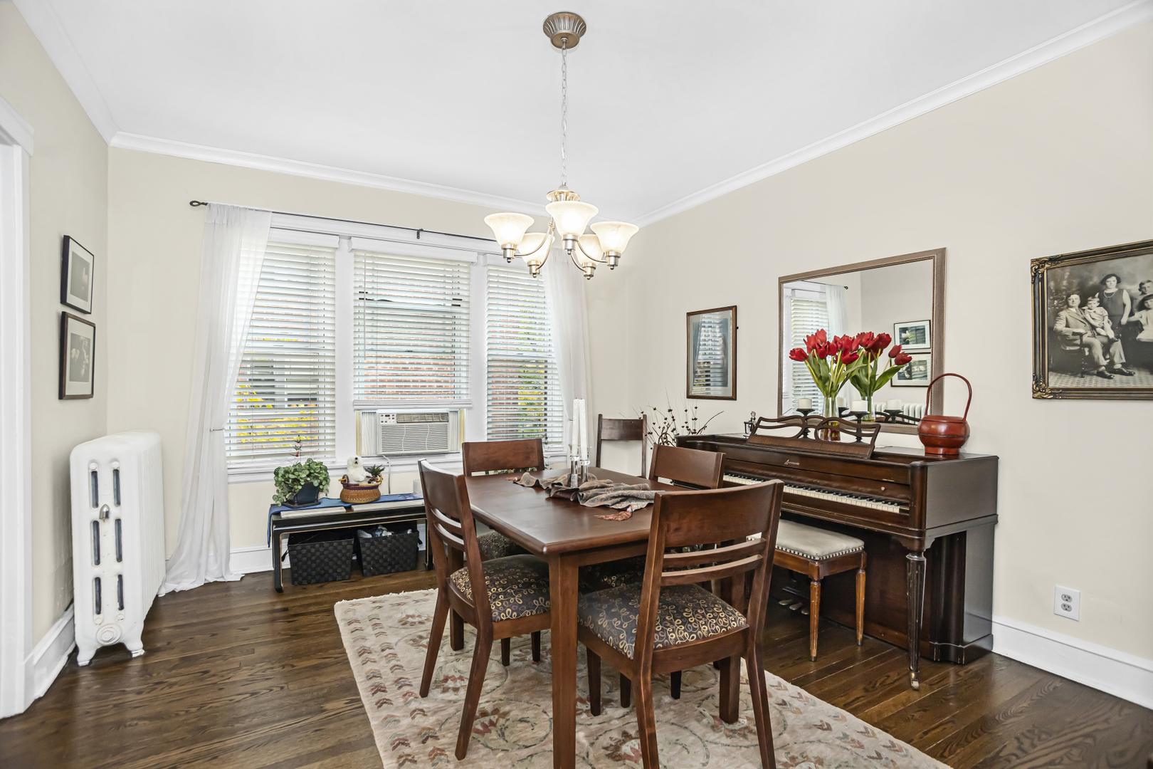 520 Sheridan Road, Unit 2A Evanston, IL 60202 - Photo 4 of 16 a view of a dining room with furniture a chandelier and wooden floor