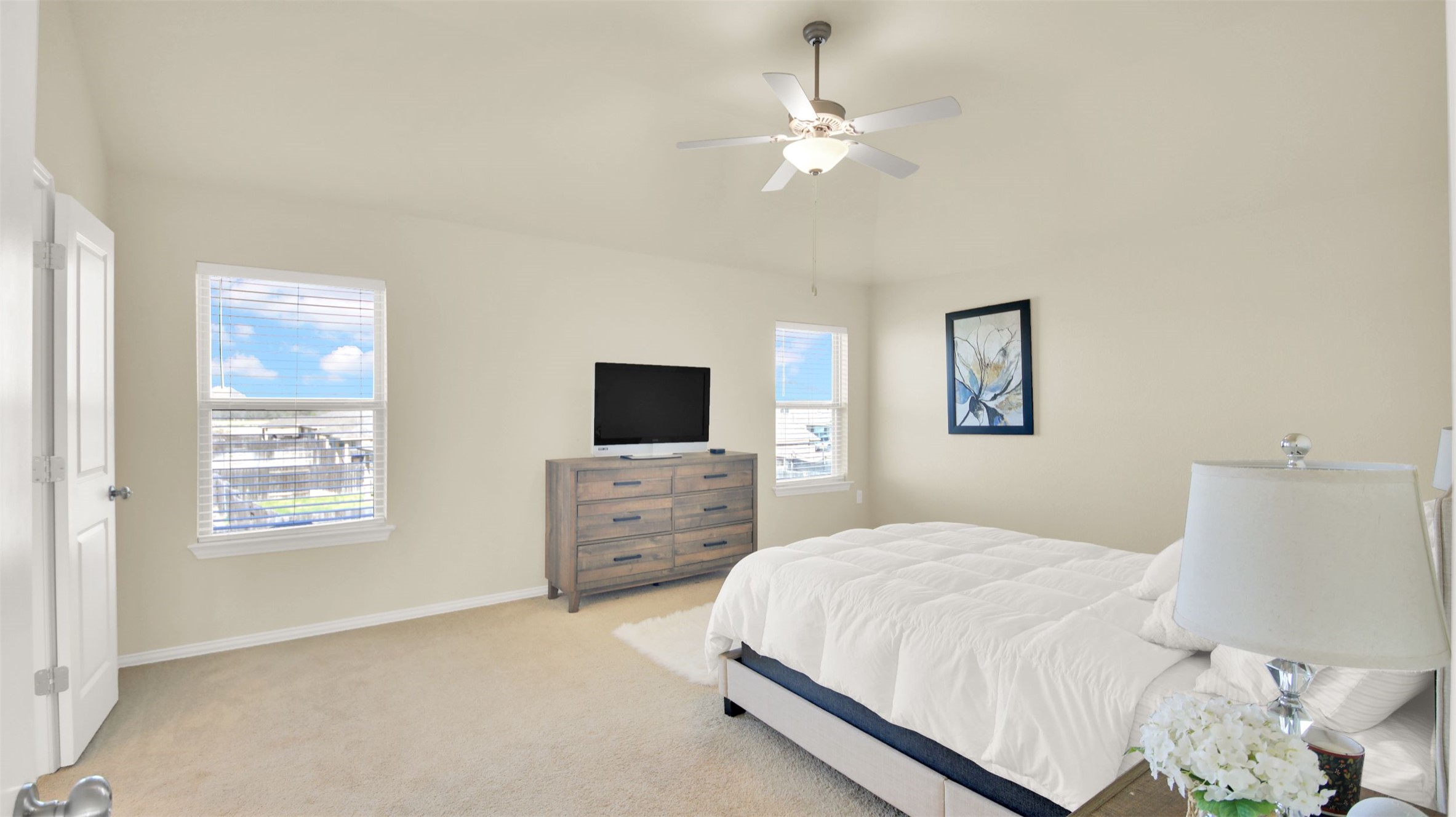 13716 Sugar Bush Path Manor, TX 78653 - Photo 32 of 37 Bedroom with light colored carpet and ceiling fan