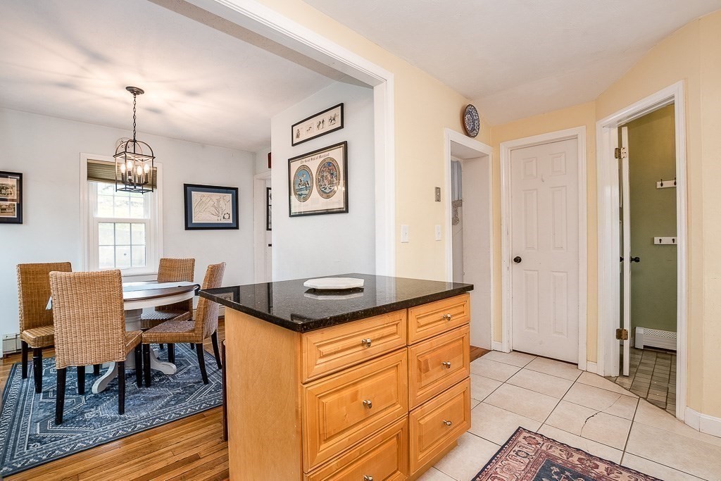 217 Lawrence Street Canton, MA 02021 - Photo 11 of 34 a view of a kitchen area with furniture and wooden floor