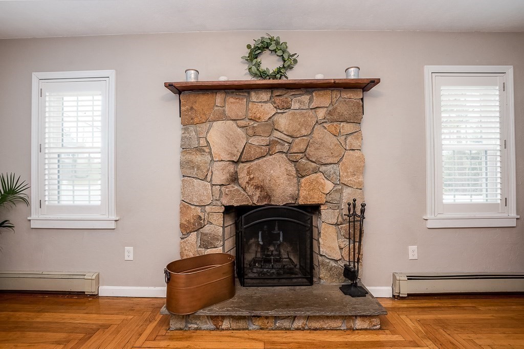 217 Lawrence Street Canton, MA 02021 - Photo 16 of 34 a living room with furniture and a fireplace