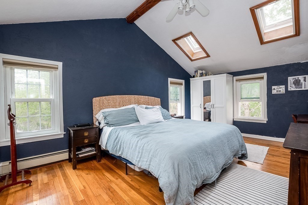 217 Lawrence Street Canton, MA 02021 - Photo 26 of 34 a bedroom with a bed a chair and a window