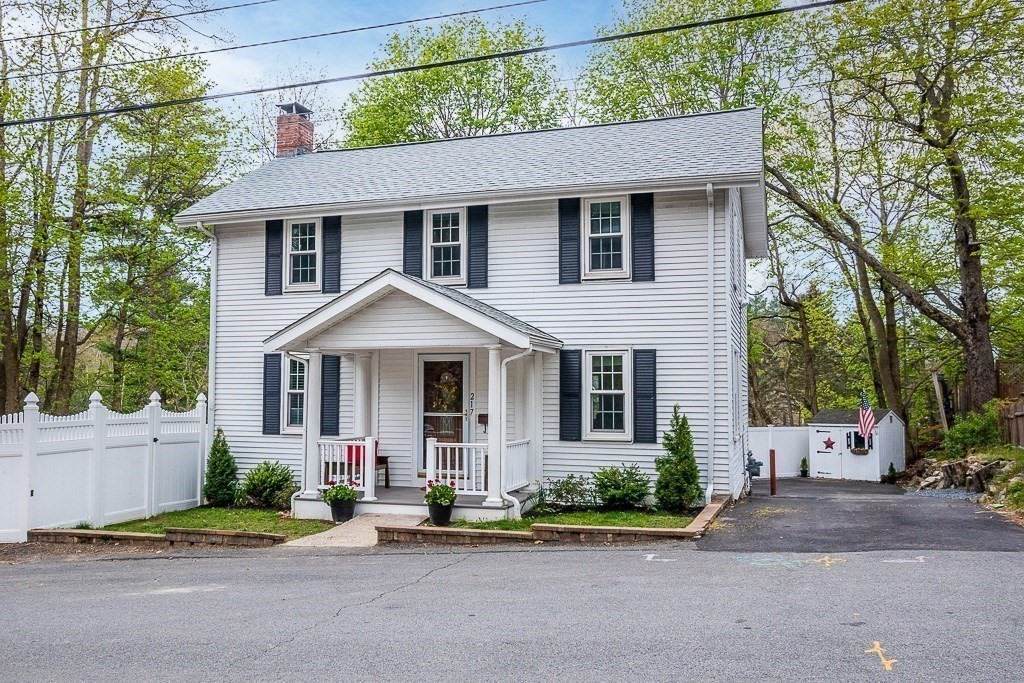 217 Lawrence Street Canton, MA 02021 - Photo 3 of 34 front view of a house with a yard
