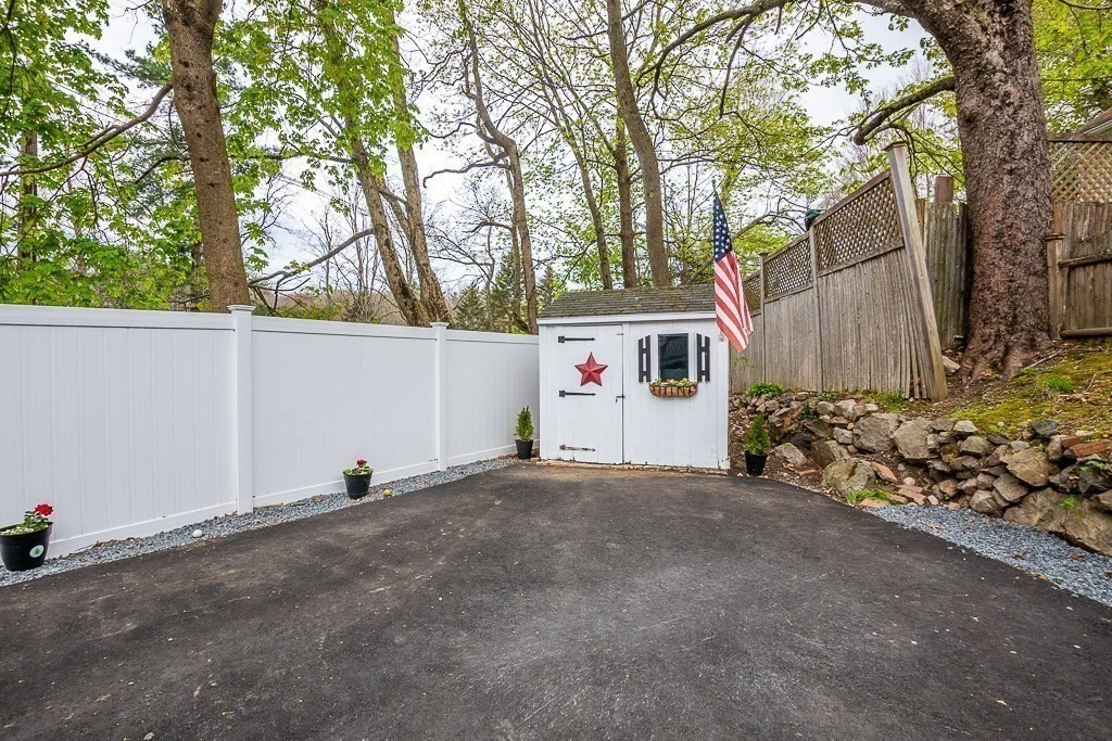 217 Lawrence Street Canton, MA 02021 - Photo 31 of 34 a view of a house with a garage
