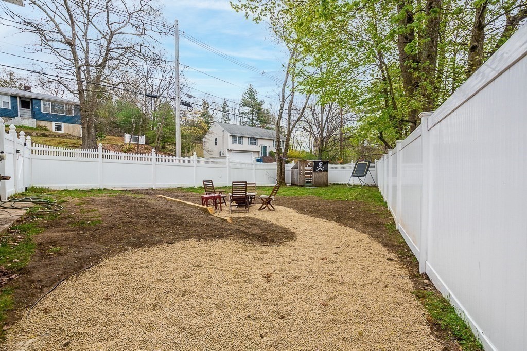 217 Lawrence Street Canton, MA 02021 - Photo 32 of 34 a view of a yard with plants and trees