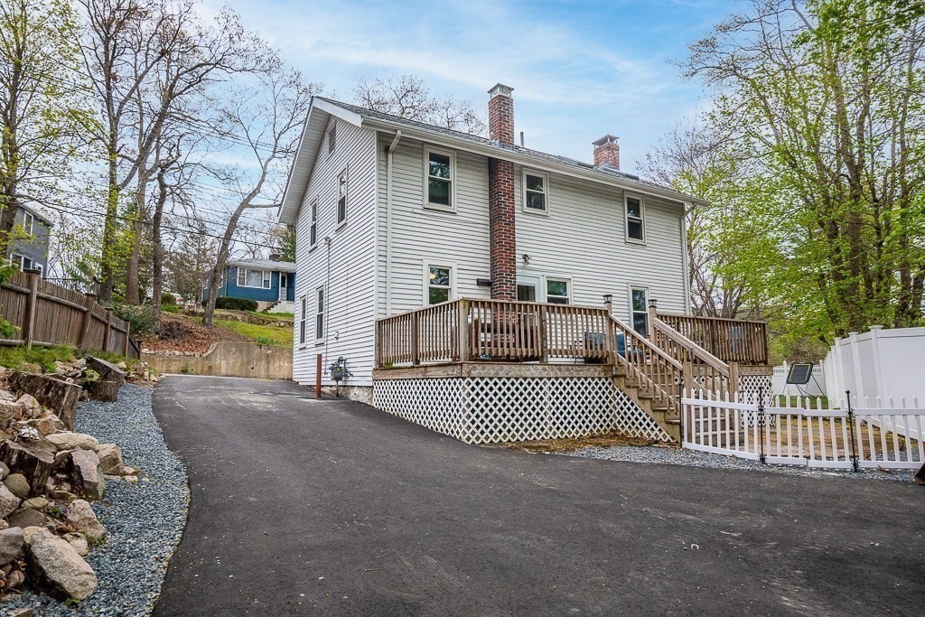 217 Lawrence Street Canton, MA 02021 - Photo 34 of 34 a view of a house with a patio and a yard