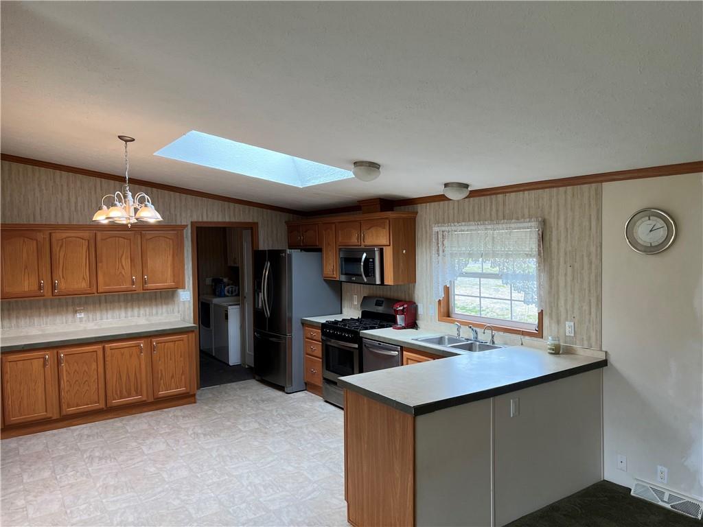 158 Nolt Road Mayport, PA 16240 - Photo 4 of 34 a kitchen with stainless steel appliances kitchen island a sink dishwasher a refrigerator and a stove