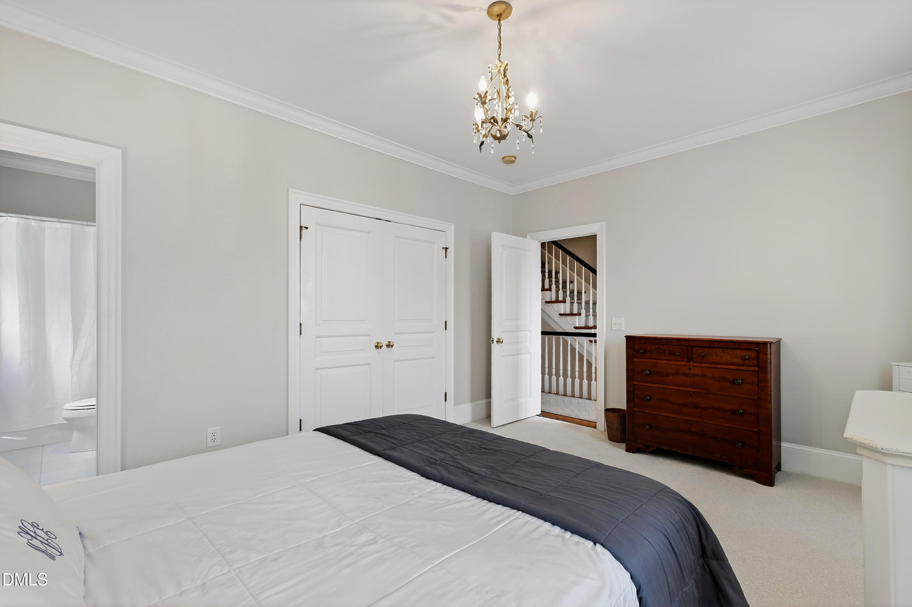 2536 Wake Drive Raleigh, NC 27608 - Photo 39 of 74 a bedroom with a bed and a dresser