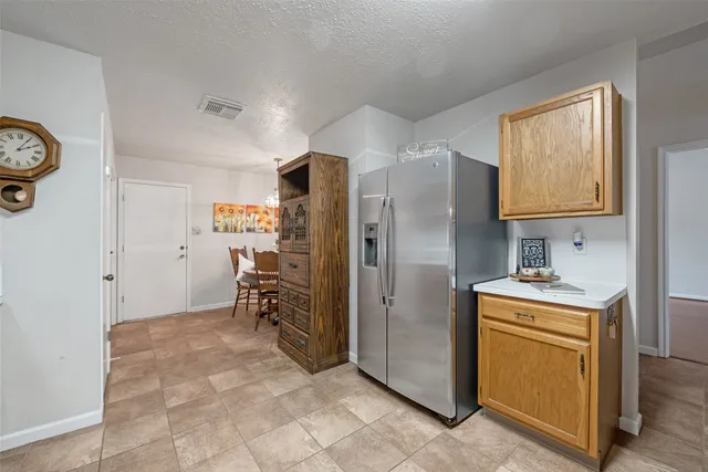 a kitchen with stainless steel appliances granite countertop a sink and cabinets