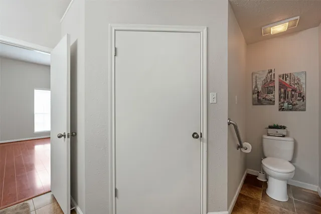 a bathroom with a shower and toilet