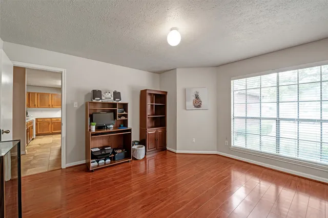 a bathroom with a sink toilet a mirror a vanity and bathtub