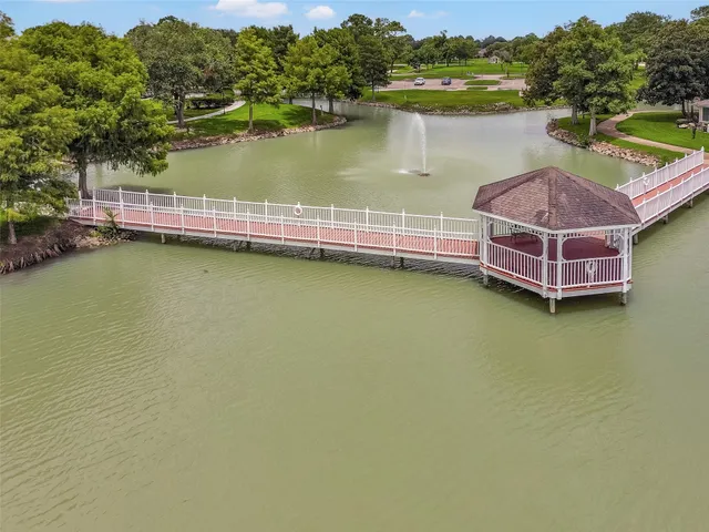 a view of a patio with table and chairs and potted plants