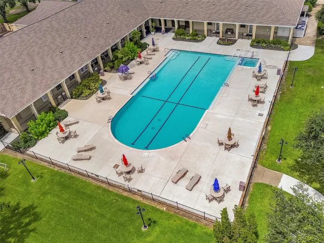 an aerial view of a house with a lake view