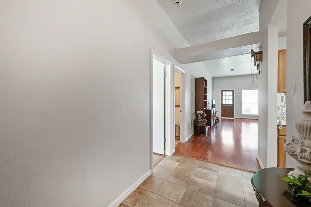 a kitchen with stainless steel appliances kitchen island granite countertop a refrigerator and a stove
