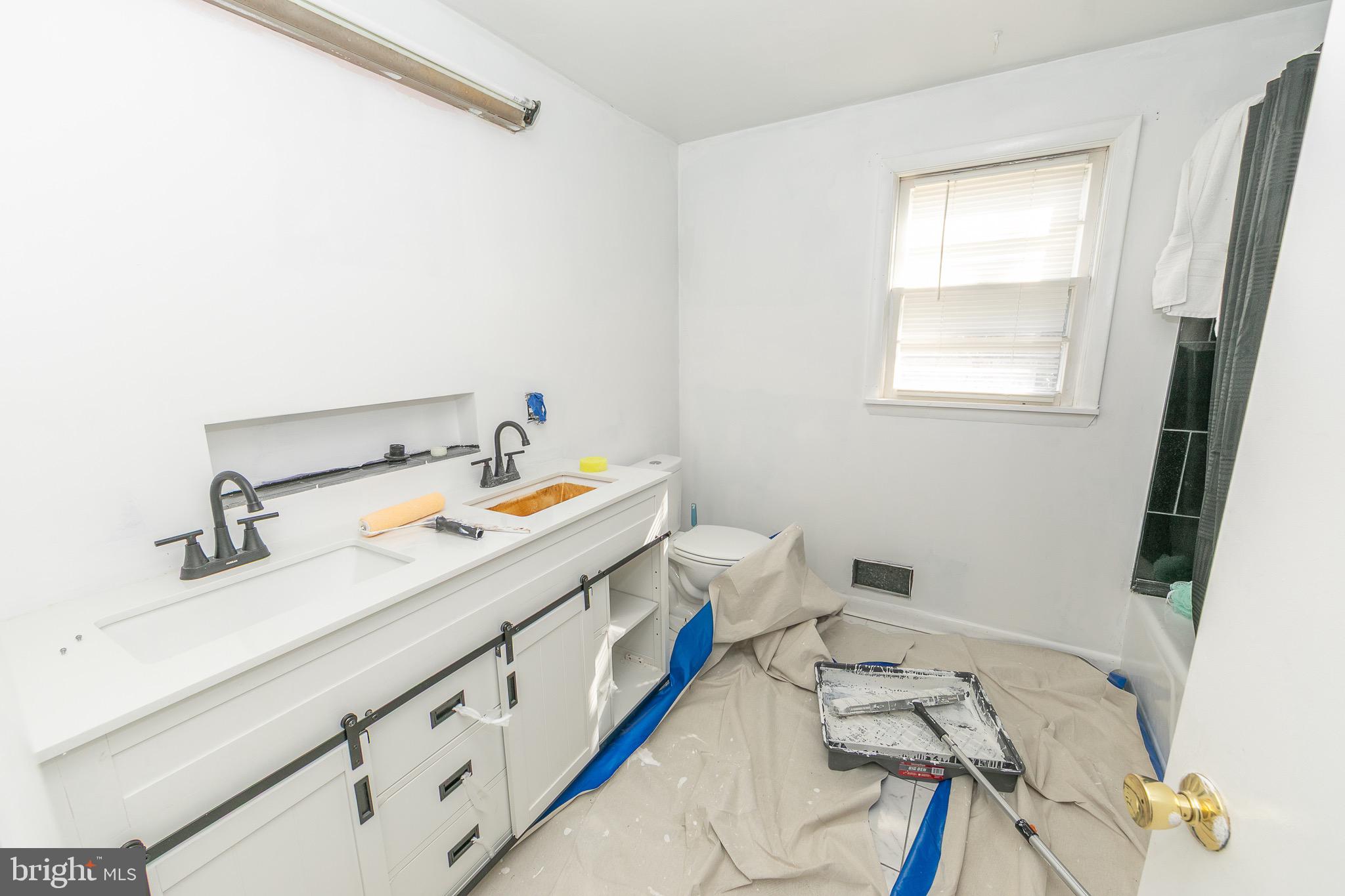 23 School Lane Carneys Point, NJ 08069 - Photo 12 of 21 a bathroom with a sink and a mirror
