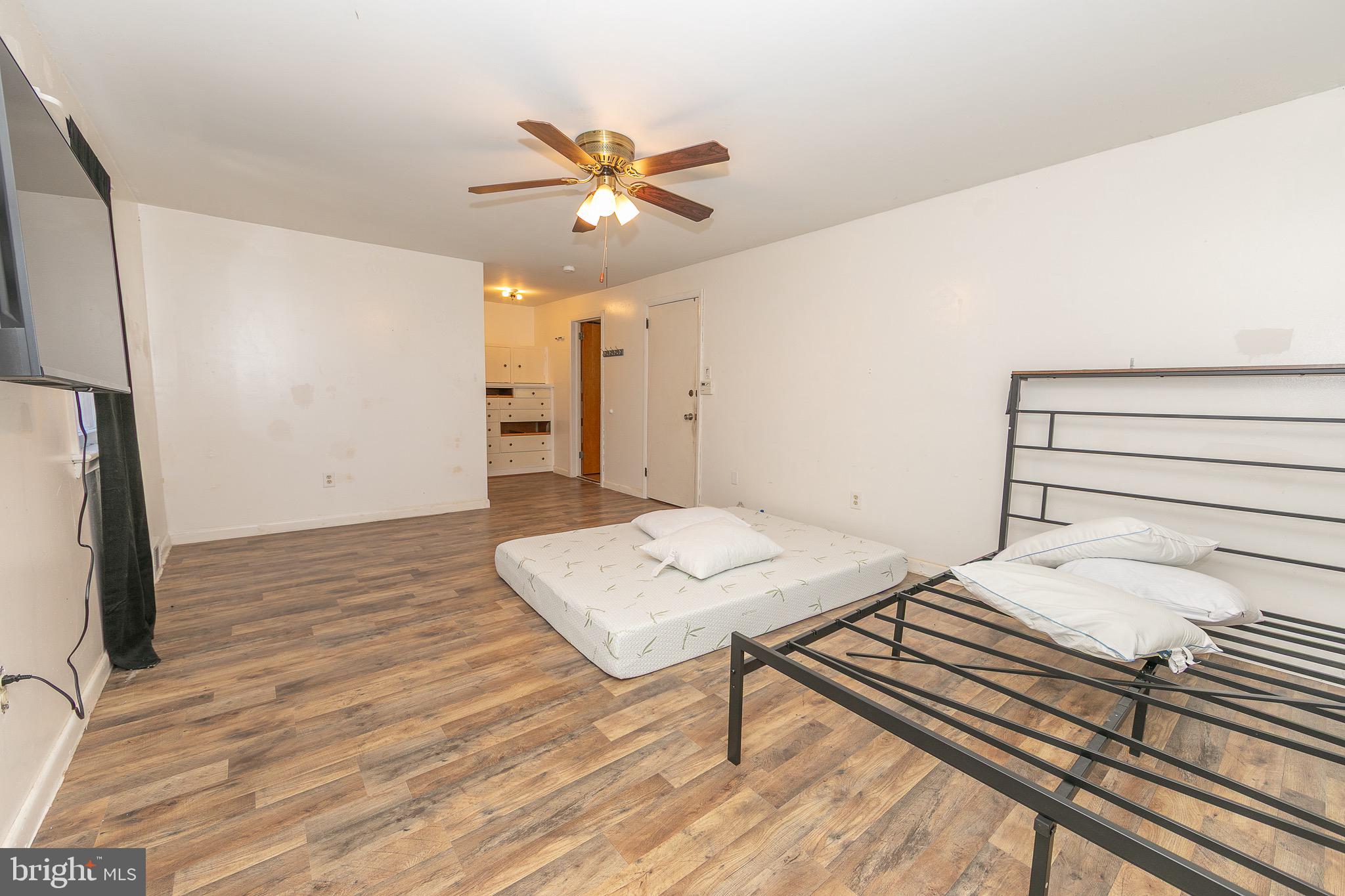 23 School Lane Carneys Point, NJ 08069 - Photo 19 of 21 a bedroom with a bed and a chandelier