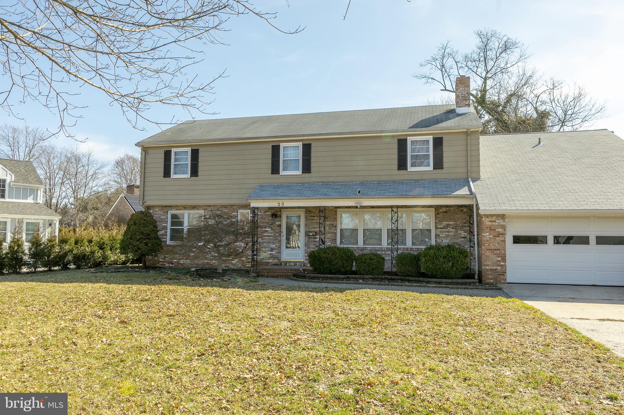 23 School Lane Carneys Point, NJ 08069 - Photo 2 of 21 a view of a brick house with a yard