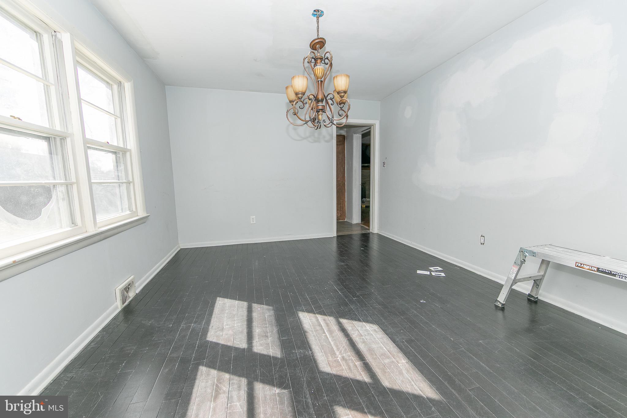 23 School Lane Carneys Point, NJ 08069 - Photo 7 of 21 wooden floor in an empty room with a window