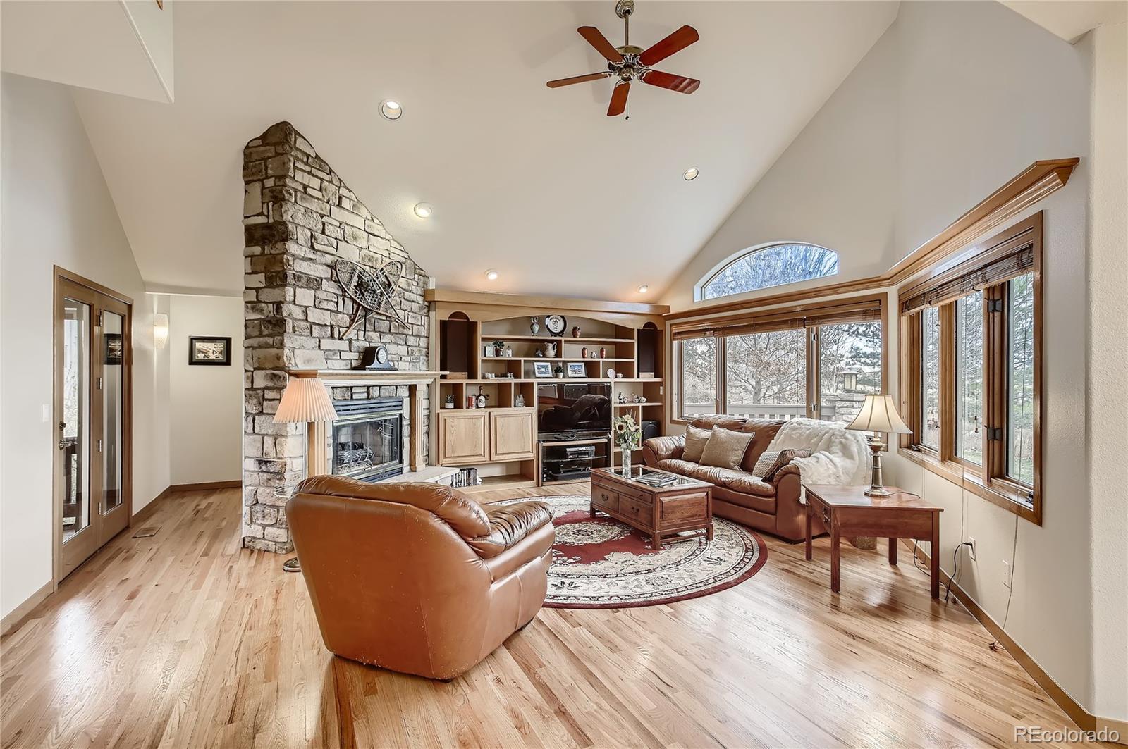 7748 Crestview Lane Niwot, CO 80504 - Photo 11 of 40 a living room with furniture fireplace and wooden floor