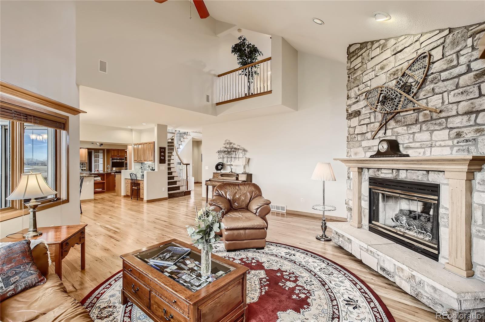 7748 Crestview Lane Niwot, CO 80504 - Photo 13 of 40 a living room with furniture and a fireplace