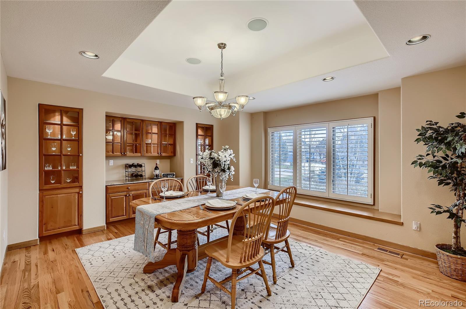 7748 Crestview Lane Niwot, CO 80504 - Photo 14 of 40 a view of a dining room with furniture window and wooden floor
