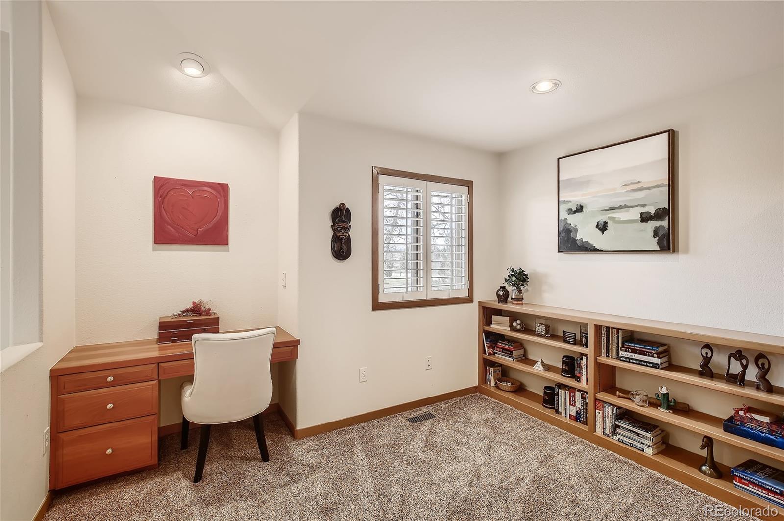 7748 Crestview Lane Niwot, CO 80504 - Photo 22 of 40 a living room with furniture and window