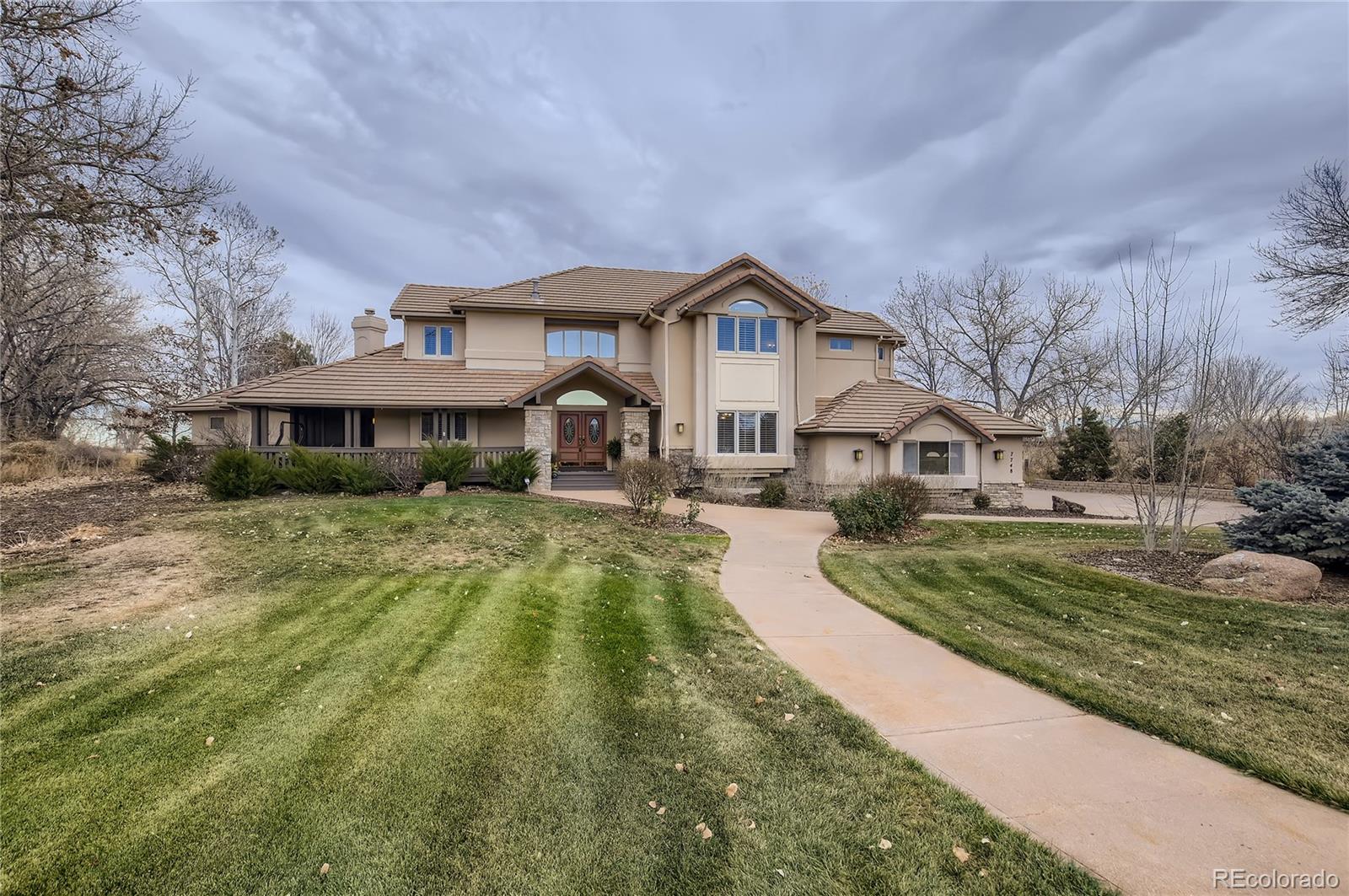 7748 Crestview Lane Niwot, CO 80504 - Photo 39 of 40 a front view of a house with a yard