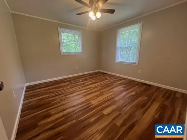 a view of room with window and ceiling fan