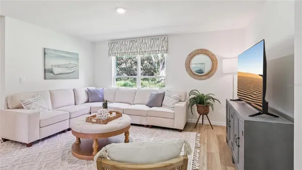 a living room with furniture and a window