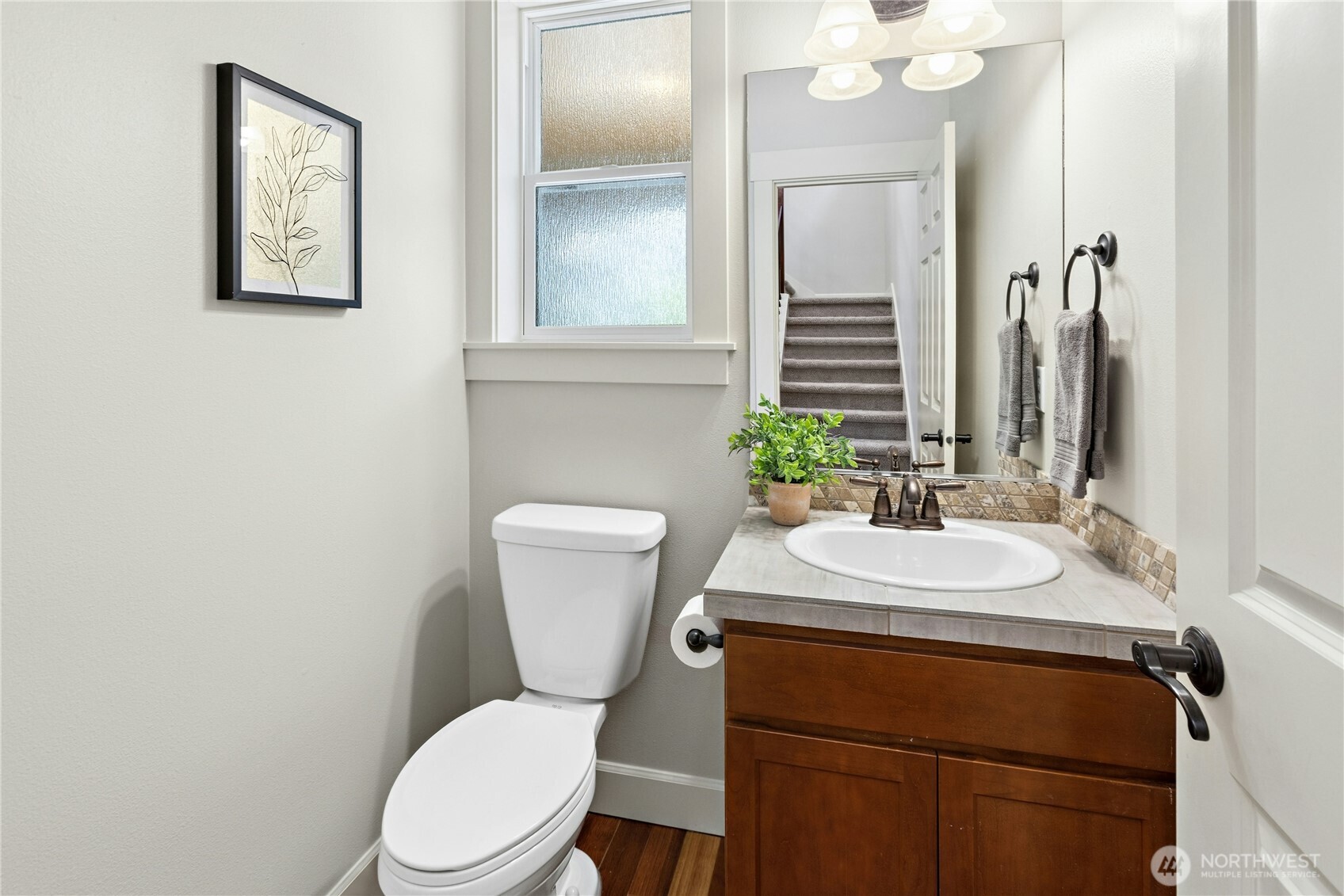 22624 43rd Drive Southeast Bothell, WA 98021 - Photo 15 of 36 a bathroom with a toilet sink and mirror