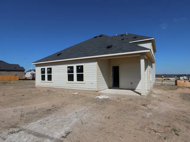 a house with trees in the background
