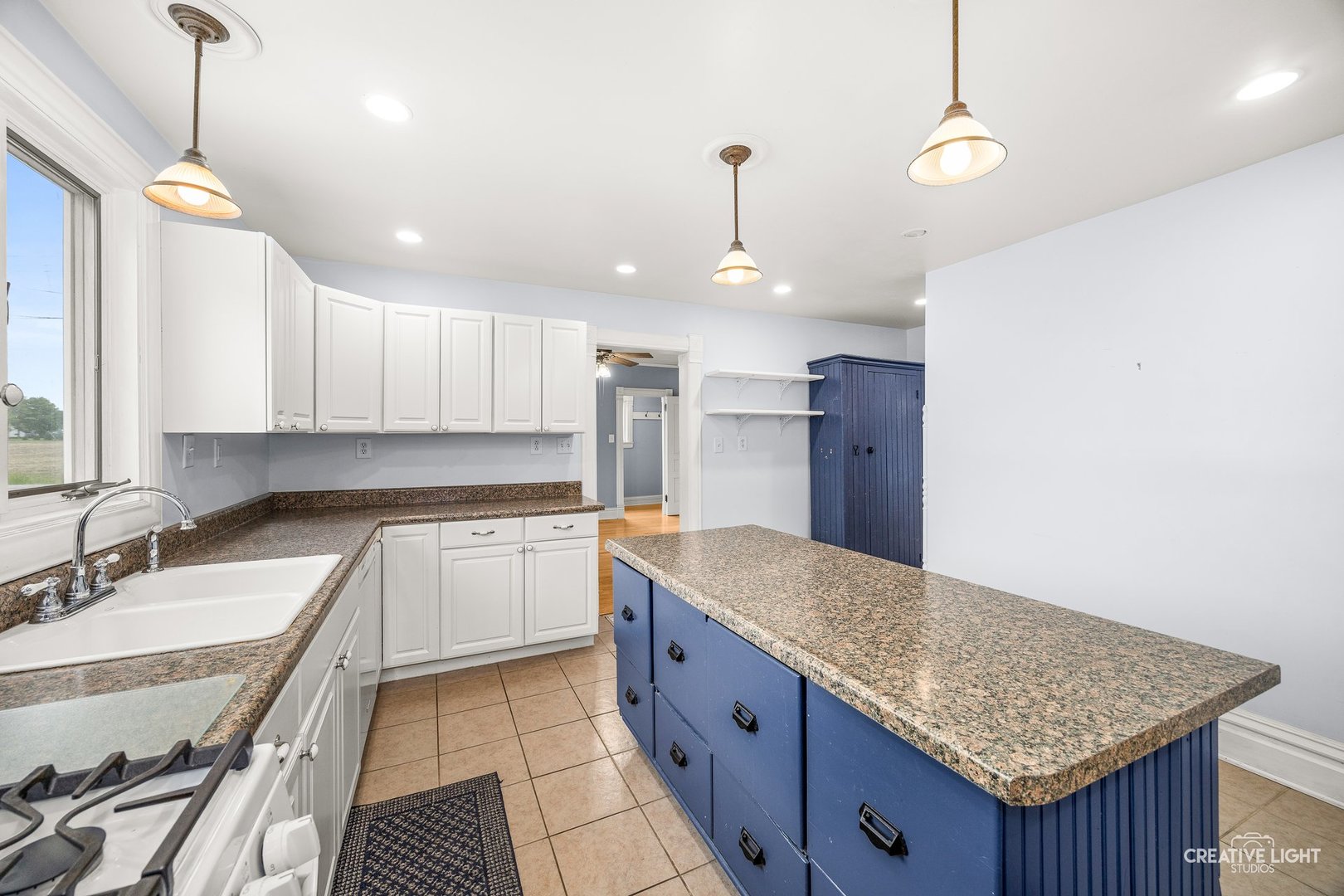 209 North Shabbona Road Shabbona, IL 60550 - Photo 12 of 25 a kitchen with a sink a counter space cabinets and appliances