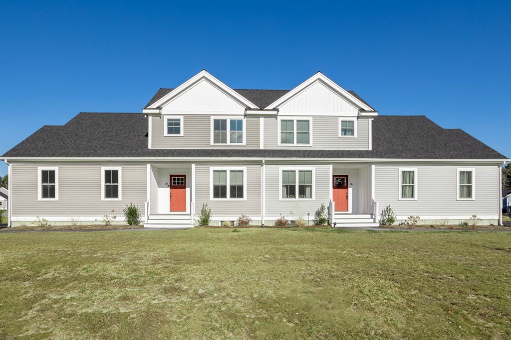 2 Katlyn Circle, Unit 15 Rochester, MA 02770 - Photo 1 of 16 a front view of house with yard and green space