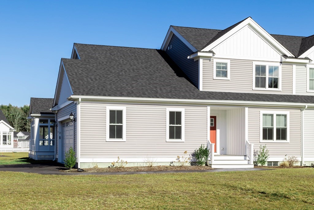2 Katlyn Circle, Unit 15 Rochester, MA 02770 - Photo 2 of 16 a front view of a house with a yard