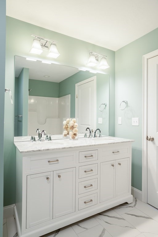2 Katlyn Circle, Unit 15 Rochester, MA 02770 - Photo 9 of 16 a bathroom with a sink vanity and mirror