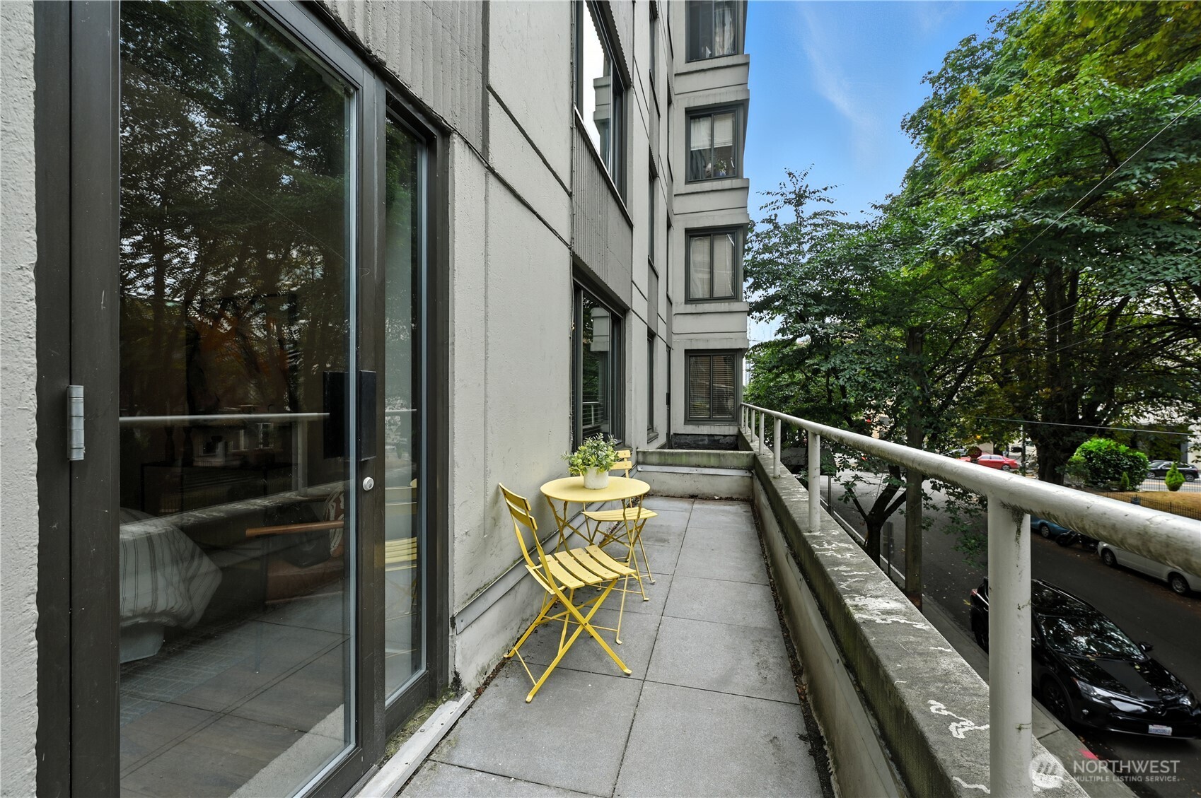 1105 Spring Street, Unit 204 Seattle, WA 98104 - Photo 11 of 17 a view of balcony with couch