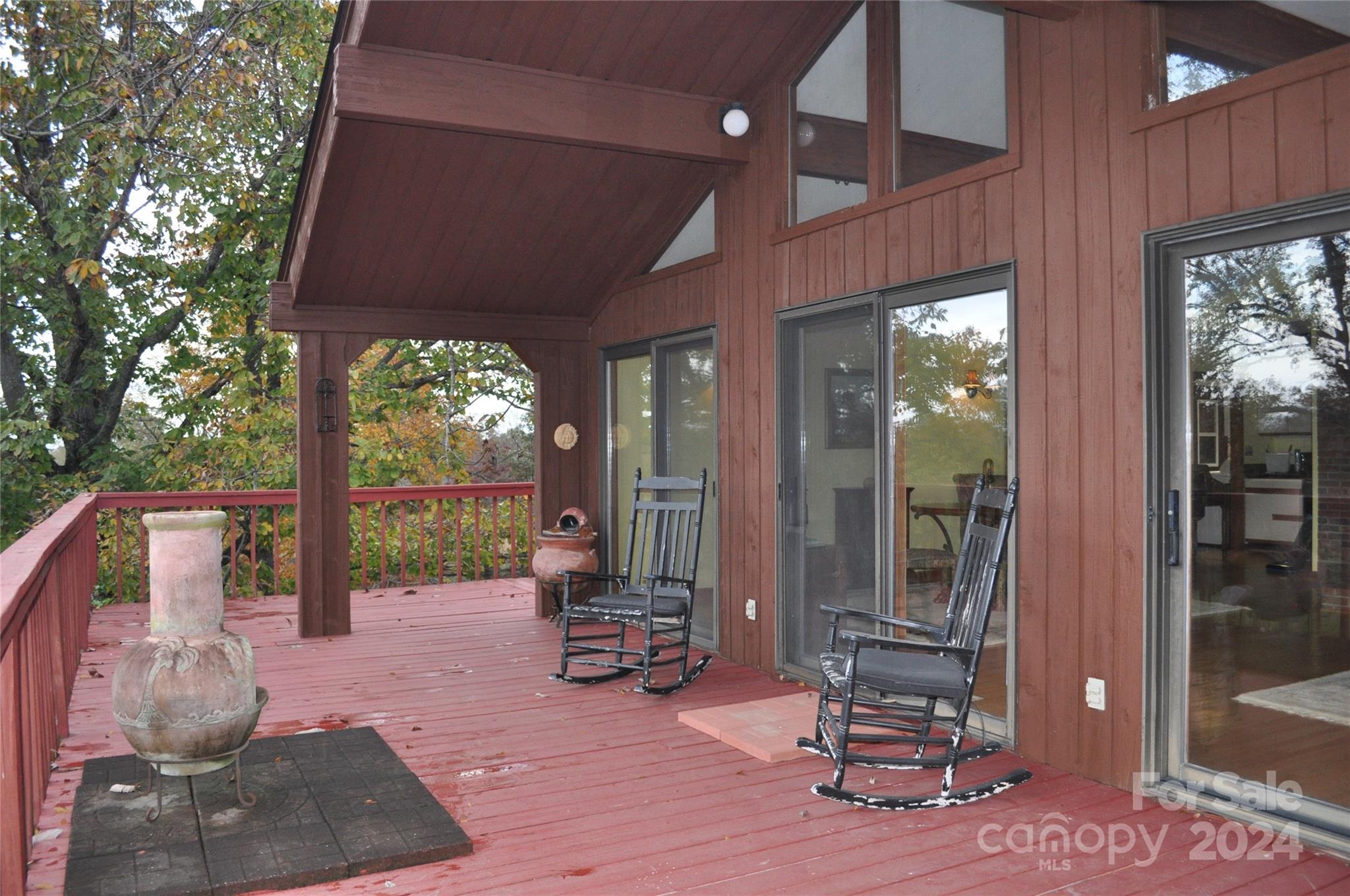 451 Bill Holbert Road Tryon, NC 28782 - Photo 12 of 35 a view of a livingroom with furniture and floor to ceiling window