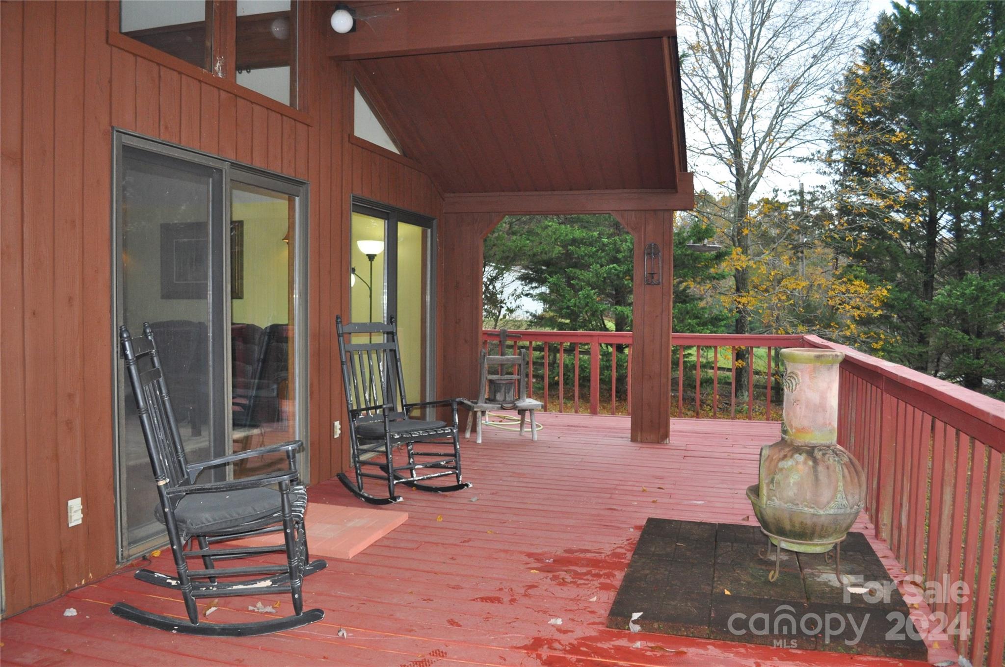 451 Bill Holbert Road Tryon, NC 28782 - Photo 13 of 35 a view of a patio with a chairs and table in the patio