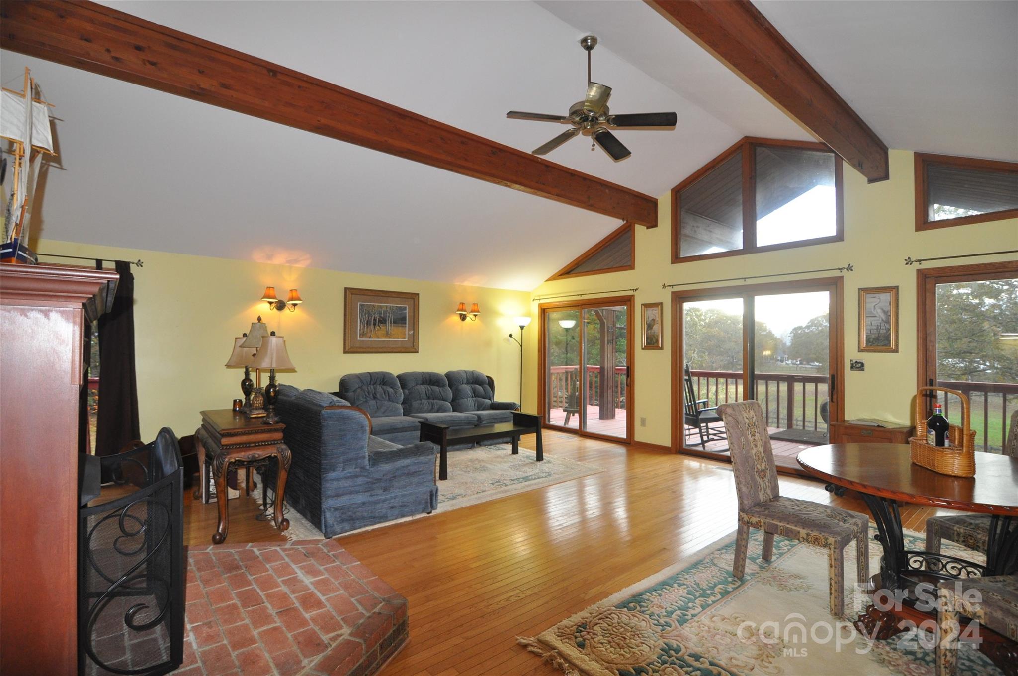 451 Bill Holbert Road Tryon, NC 28782 - Photo 21 of 35 a living room with fireplace furniture and a large window
