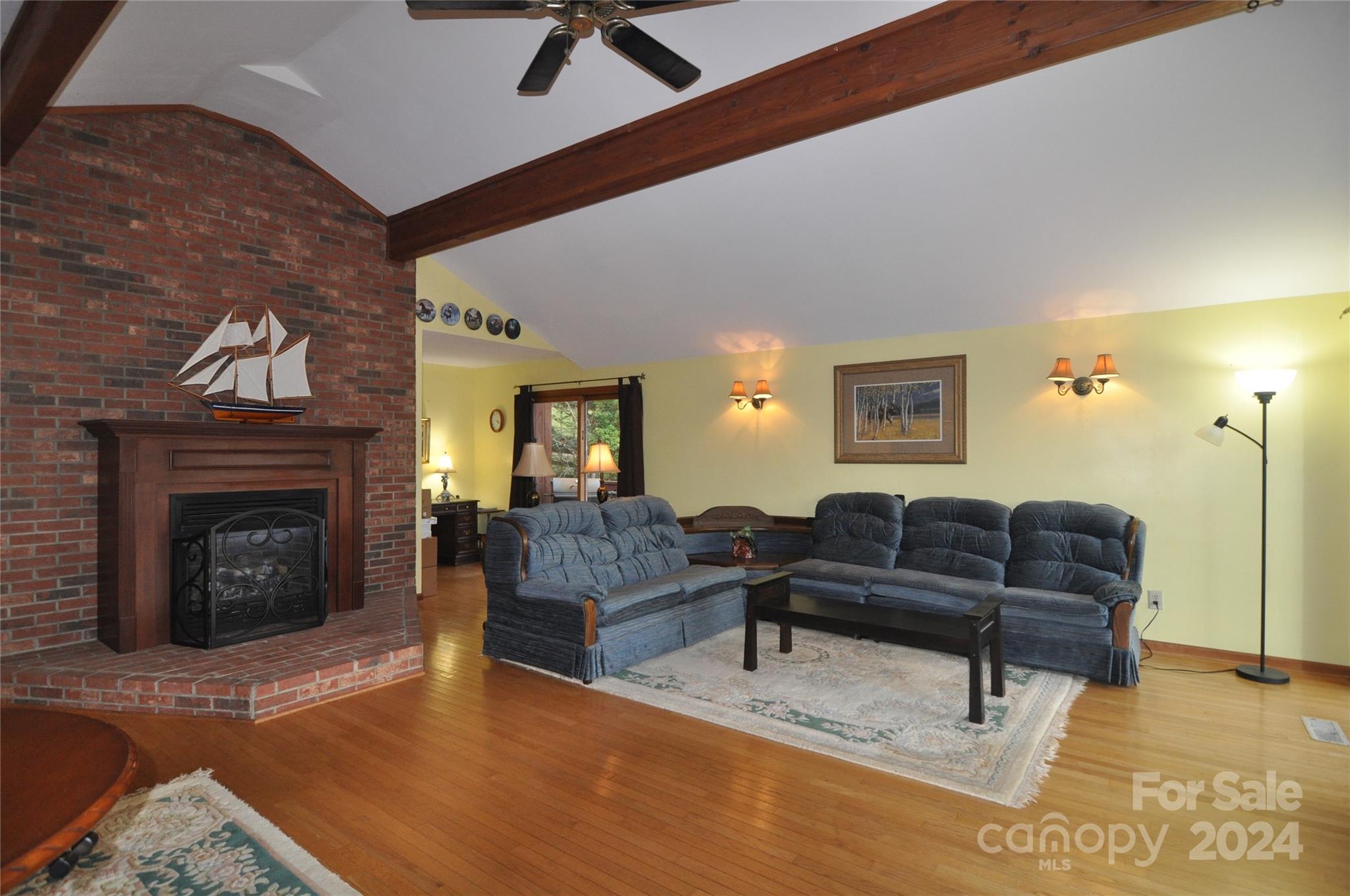 451 Bill Holbert Road Tryon, NC 28782 - Photo 22 of 35 a living room with furniture and a fireplace