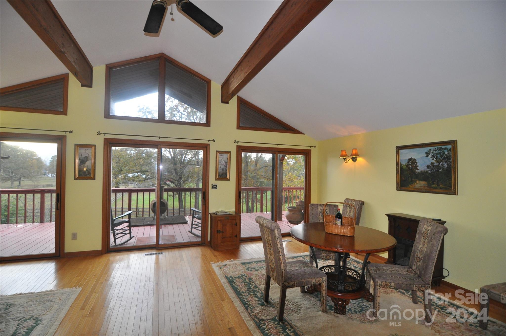451 Bill Holbert Road Tryon, NC 28782 - Photo 23 of 35 a view of a dining room with furniture window and wooden floor