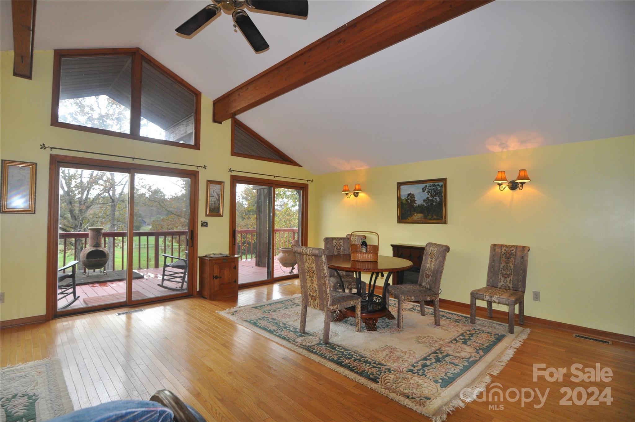 451 Bill Holbert Road Tryon, NC 28782 - Photo 24 of 35 a living room with furniture and a floor to ceiling window
