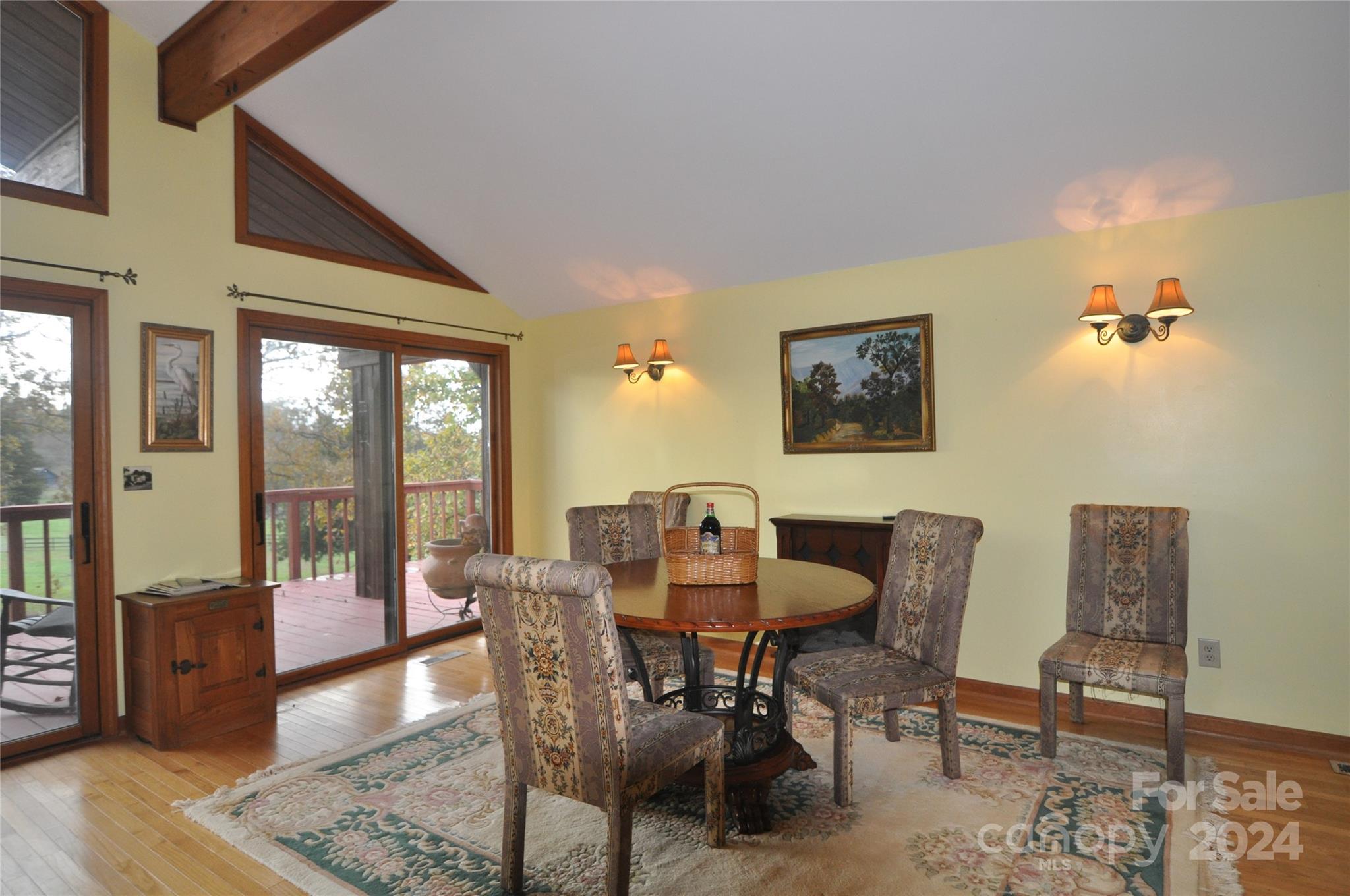 451 Bill Holbert Road Tryon, NC 28782 - Photo 26 of 35 a dining room with furniture and wooden floor