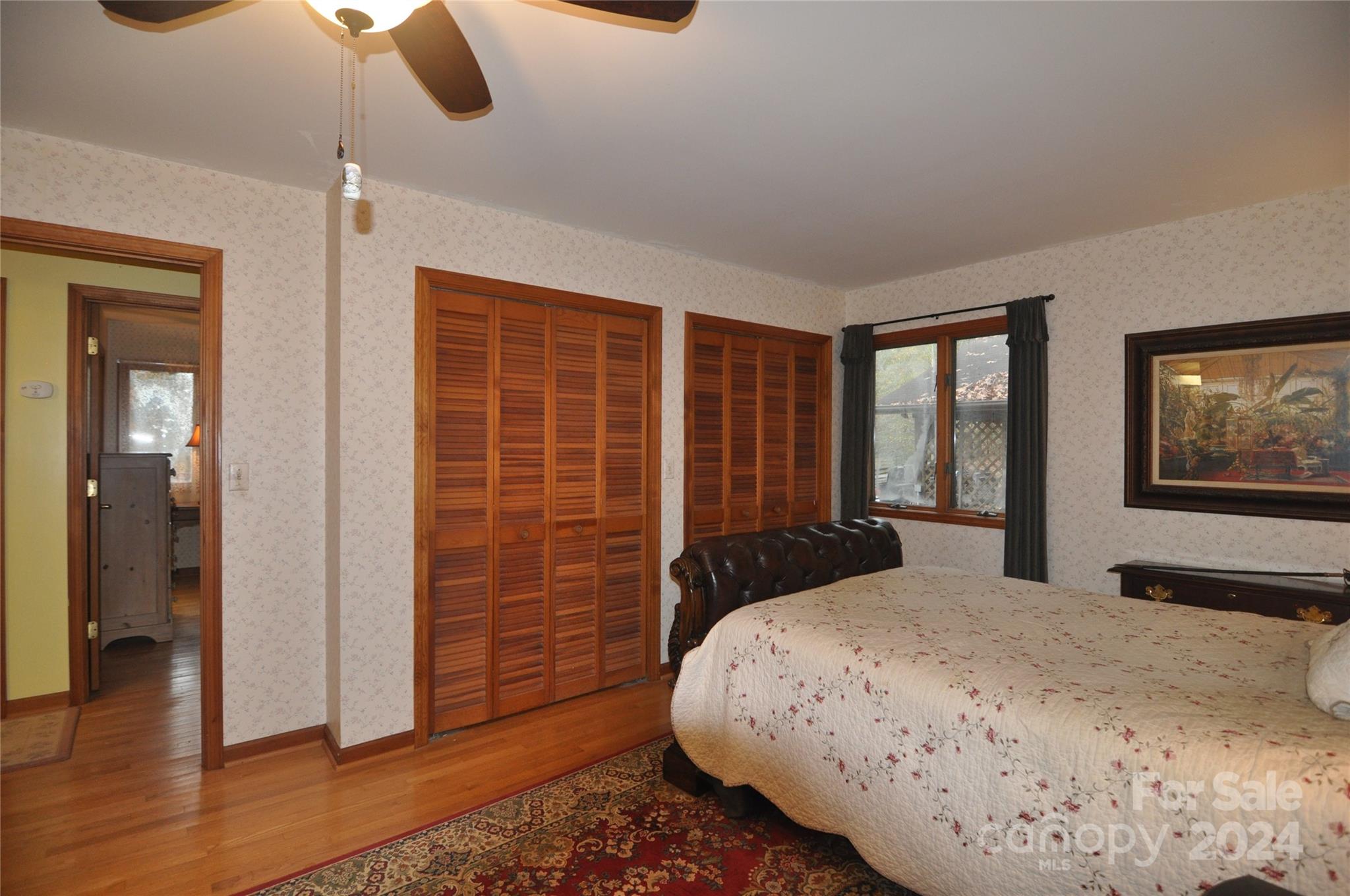 451 Bill Holbert Road Tryon, NC 28782 - Photo 31 of 35 a bedroom with a large bed and a window