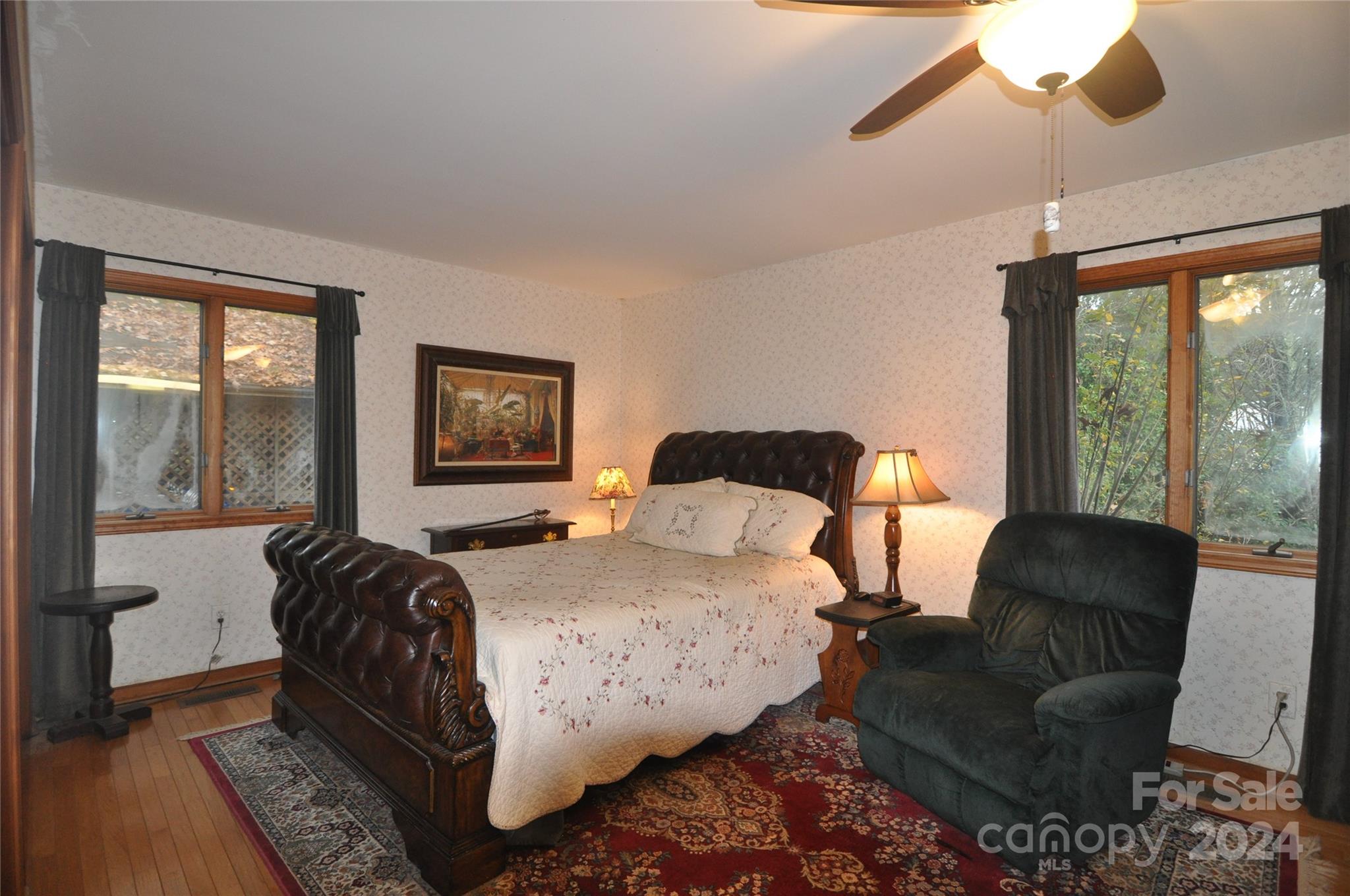 451 Bill Holbert Road Tryon, NC 28782 - Photo 32 of 35 a bedroom with a bed and a couch next to a window