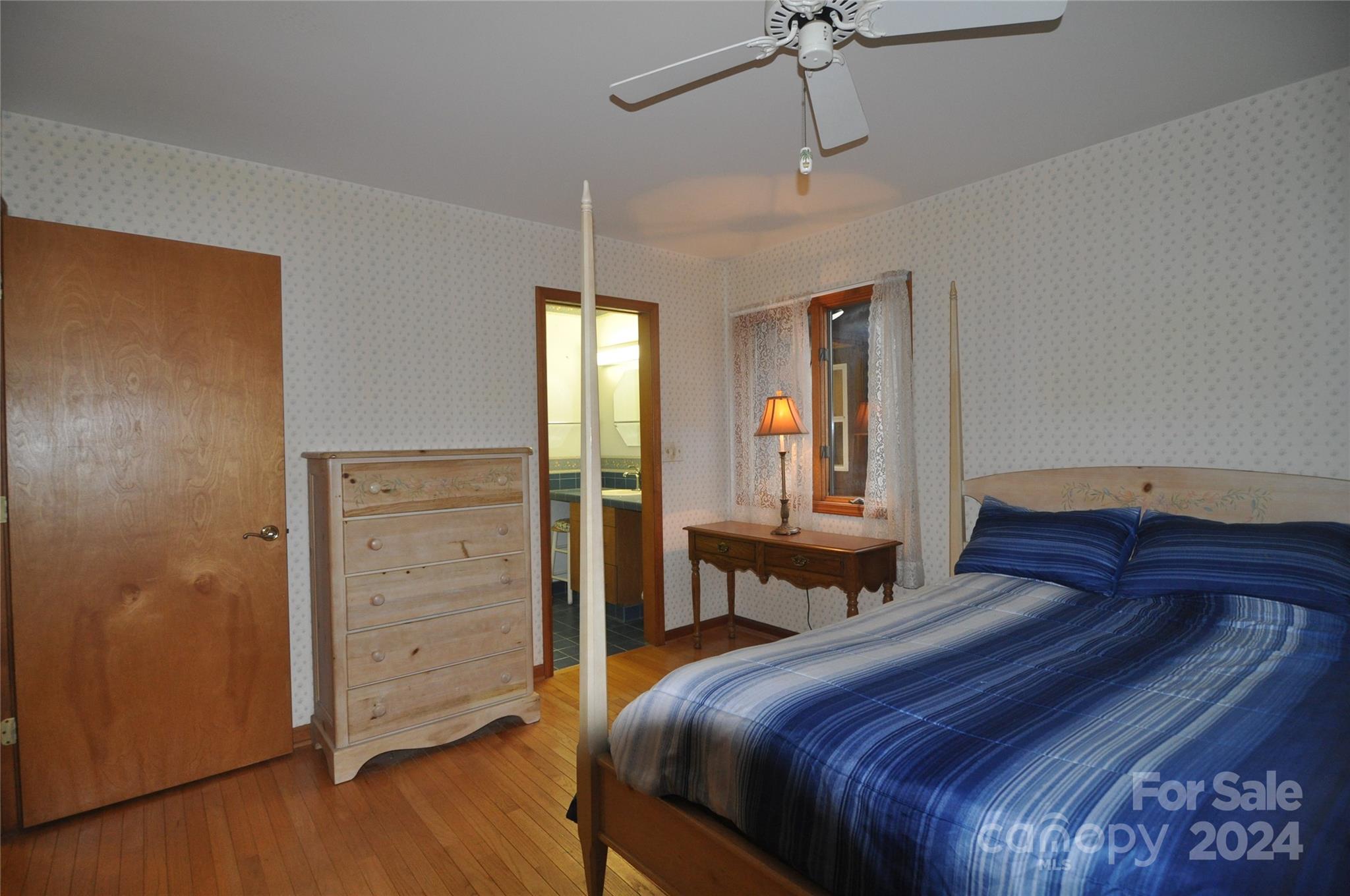 451 Bill Holbert Road Tryon, NC 28782 - Photo 34 of 35 a bedroom with a bed and a dresser