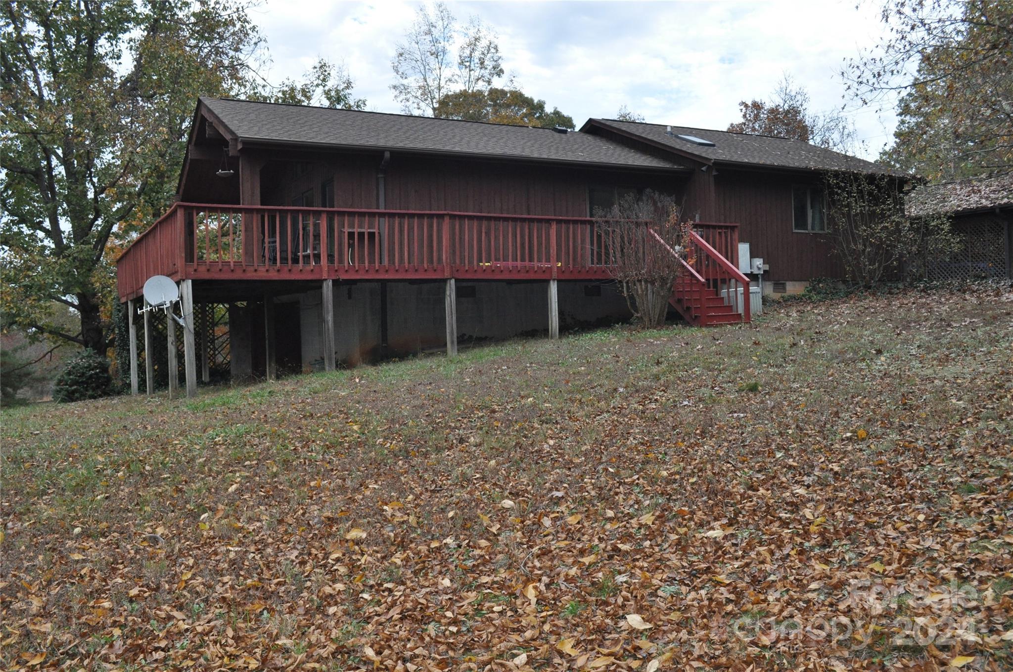 451 Bill Holbert Road Tryon, NC 28782 - Photo 7 of 35 a backyard of a house with table and chairs