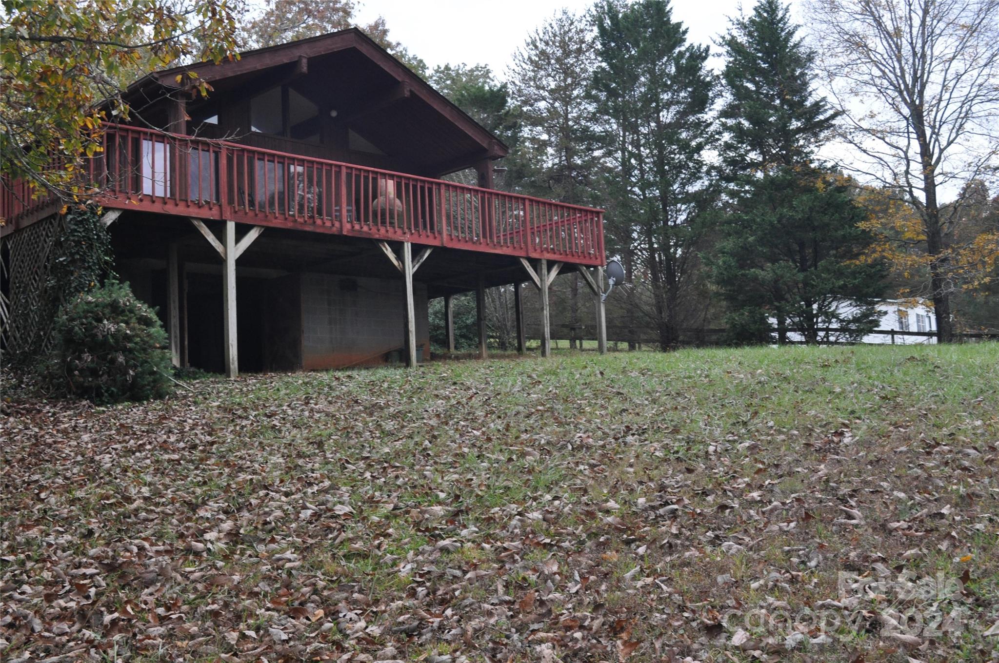 451 Bill Holbert Road Tryon, NC 28782 - Photo 8 of 35 a front view of a house with garden