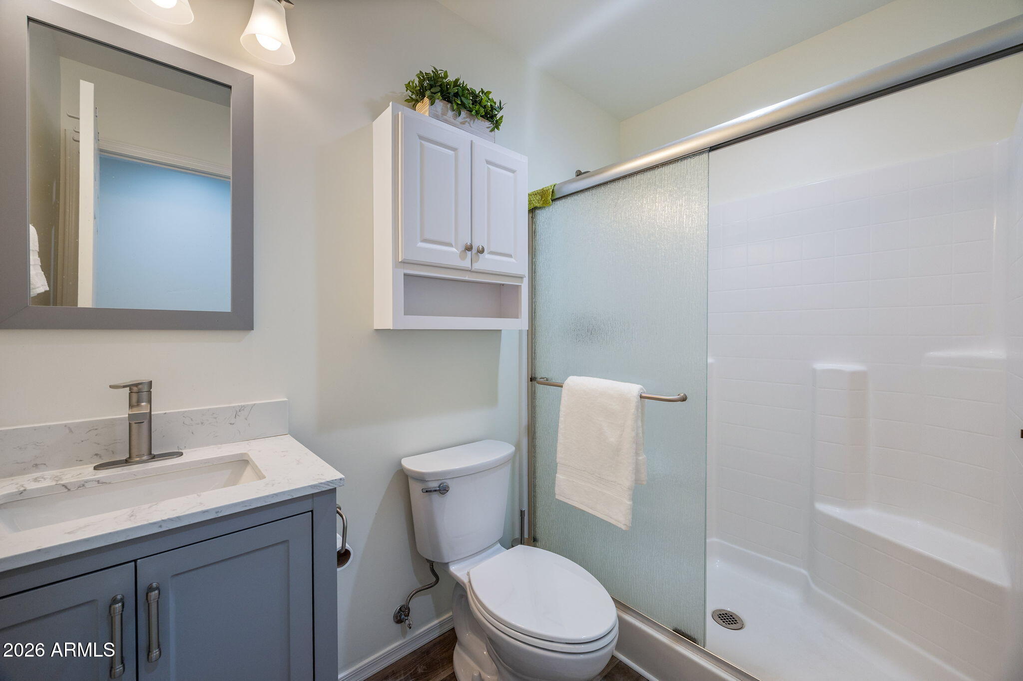 5145 Drifting Snow Loop Pinetop, AZ 85935 - Photo 16 of 37 a bathroom with a sink a toilet and shower